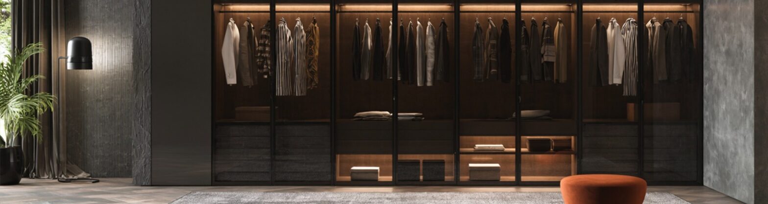 Luxury stainless steel wardrobe with glass doors, LED lighting, and organized clothing display